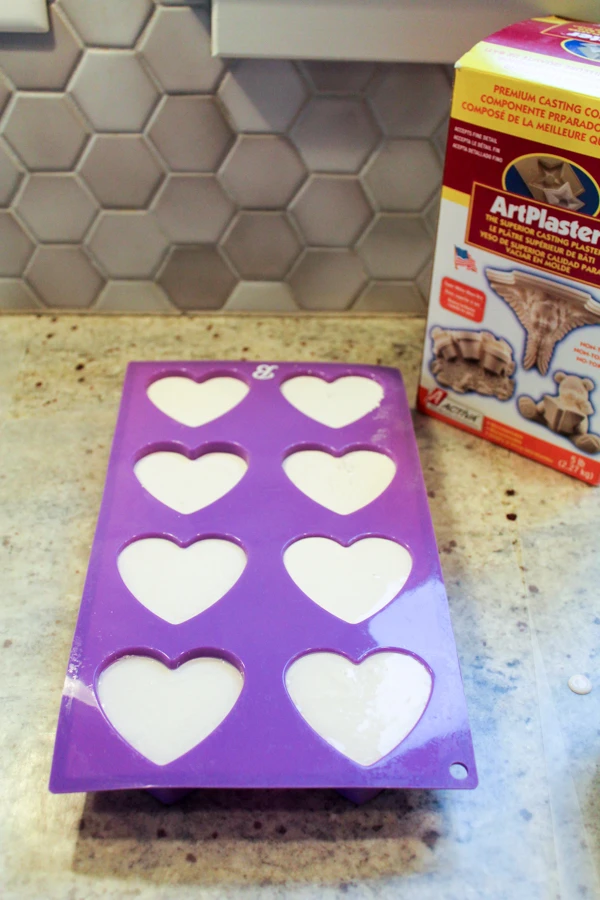 Pour ArtPlaster into a silicone mold to create heart-shaped kindness rocks.